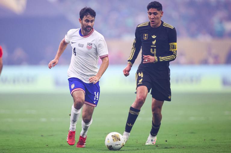 Edson &Aacute;lvarez of Mexico competes with Luca de la Torre of the United States for possession during the 2025 CONCACAF Gold Cup final between Mexico and the USA.