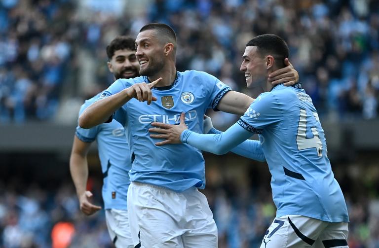 MANCHESTER, ENGLAND - OCTOBER 05: Mateo Kovacic of Manchester City celebrates scoring his team's second goal with teammate Phil Foden during the Premier League match between Manchester City FC and Fulham FC at Etihad Stadium on October 05, 2024 in Manchester, England. (Photo by Gareth Copley/Getty Images)