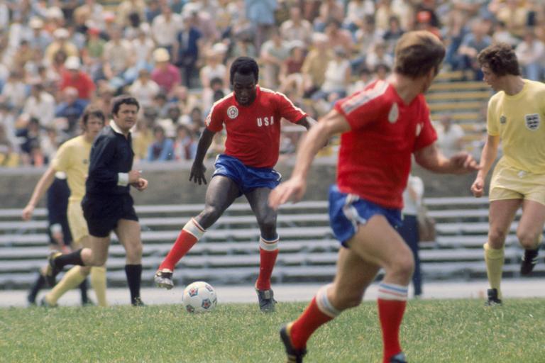 Pele (representing Team America) in action watched by England's Mick Channon (l) and Trevor Cherry (r). The referee is Walter Hungerbuhler from Switzerland.   (Photo by Peter Robinson - PA Images via Getty Images)
