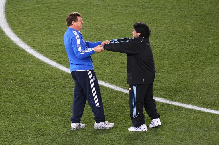 POLOKWANE, SOUTH AFRICA - JUNE 22:  Diego Maradona head coach of Argentina greets Otto Rehhagel head coach of Greece prior to the 2010 FIFA World Cup South Africa Group B match between Greece and Argentina at Peter Mokaba Stadium on June 22, 2010 in Polokwane, South Africa.  (Photo by Martin Rose/Getty Images)