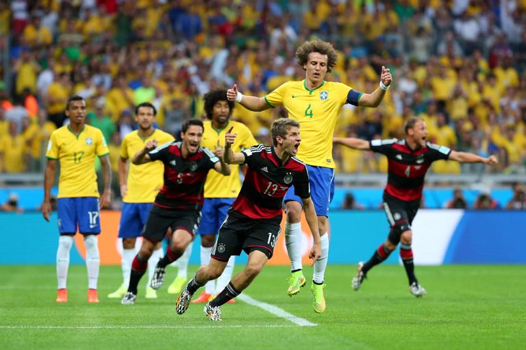 BELO HORIZONTE, BRAZIL - JULY 08:  Thomas Mueller (C) of Germany celebrates scoring his team's first goal during the 2014 FIFA World Cup Brazil Semi Final match between Brazil and Germany at Estadio Mineirao on July 8, 2014 in Belo Horizonte, Brazil.  (Photo by Alex Livesey - FIFA/FIFA via Getty Images)